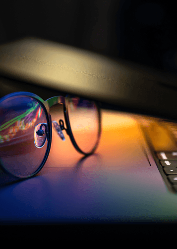 Hands protecting wooden blocks symbolizing company values