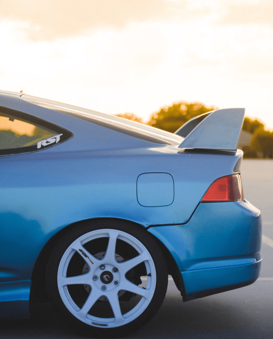 Various automotive spare parts on wooden surface